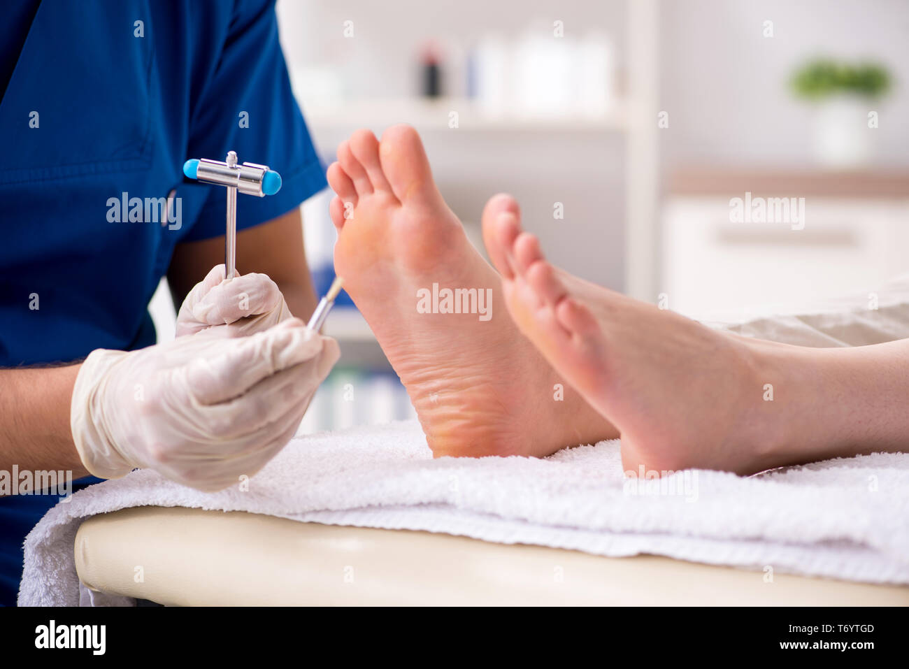 The podiatrist treating feet during procedure Stock Photo Alamy