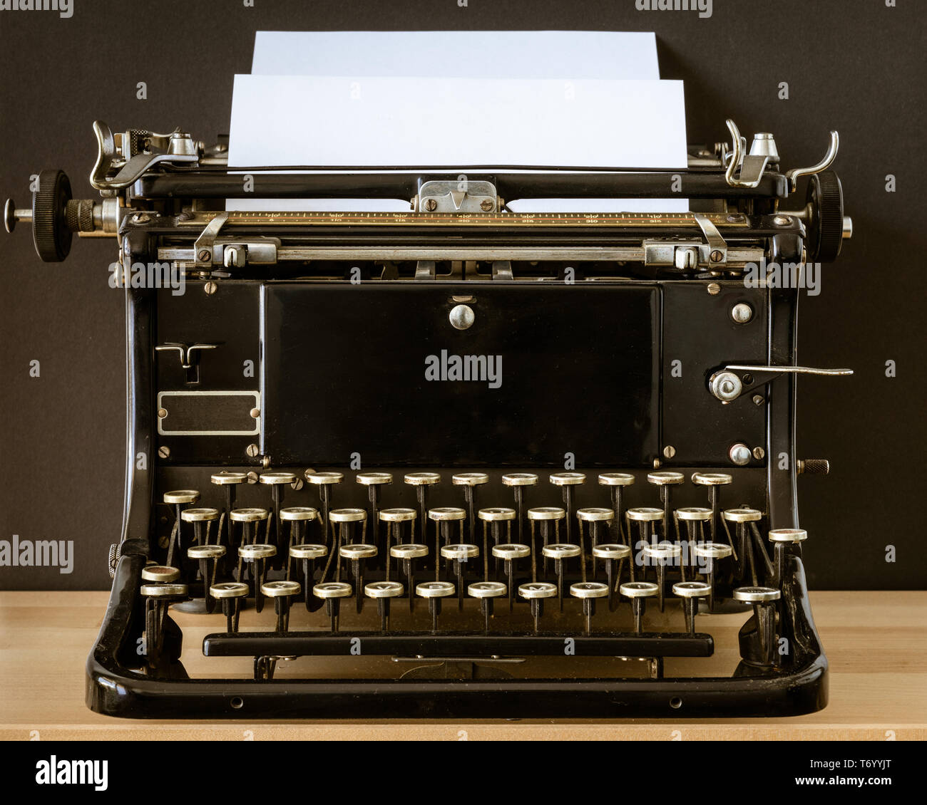 Vintage typewriter with a blank piece of paper Stock Photo - Alamy