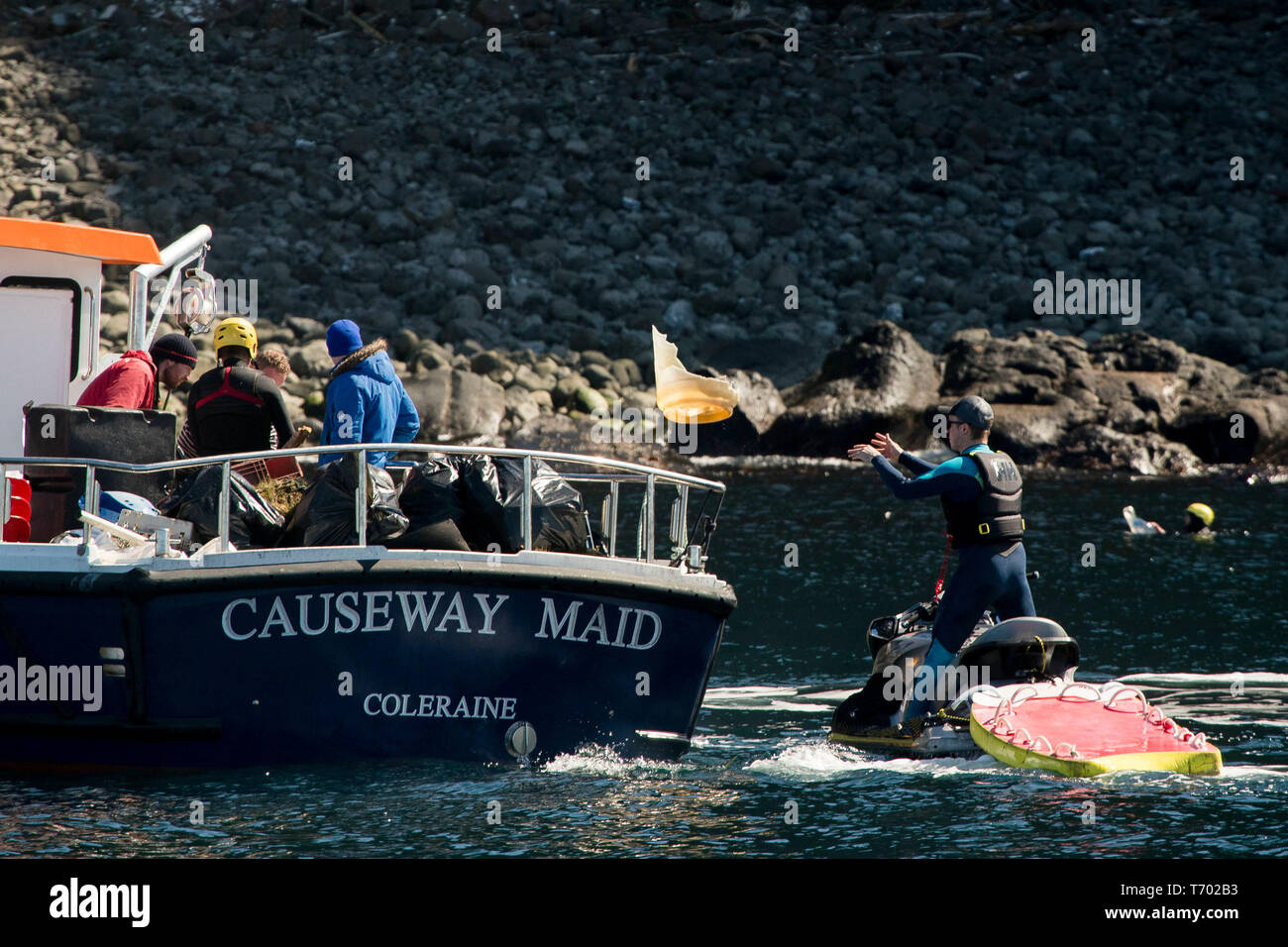 Volunteers load rubbish onto hires stock photography and images Alamy