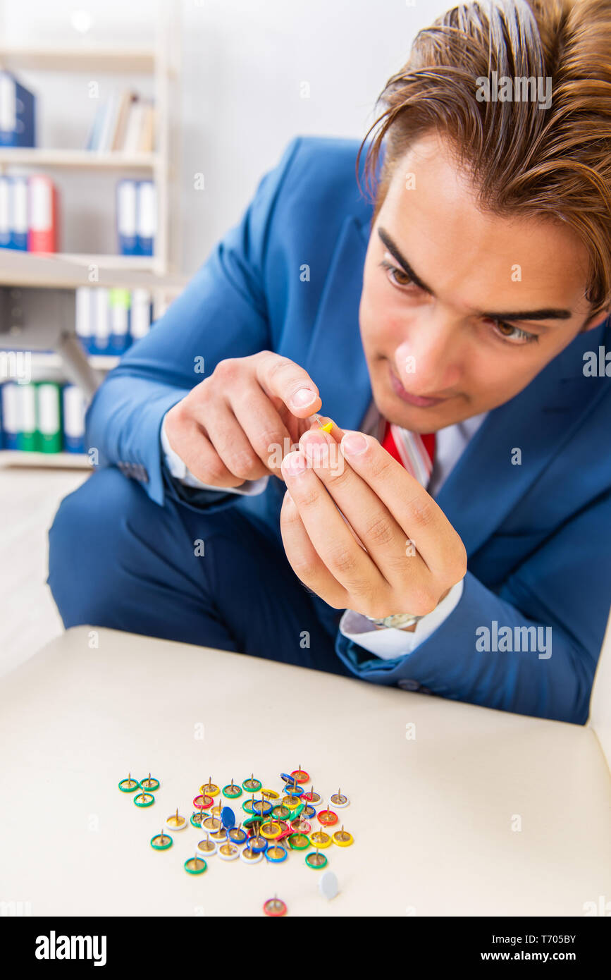 Office prank with sharp thumbtacks on chair Stock Photo Alamy