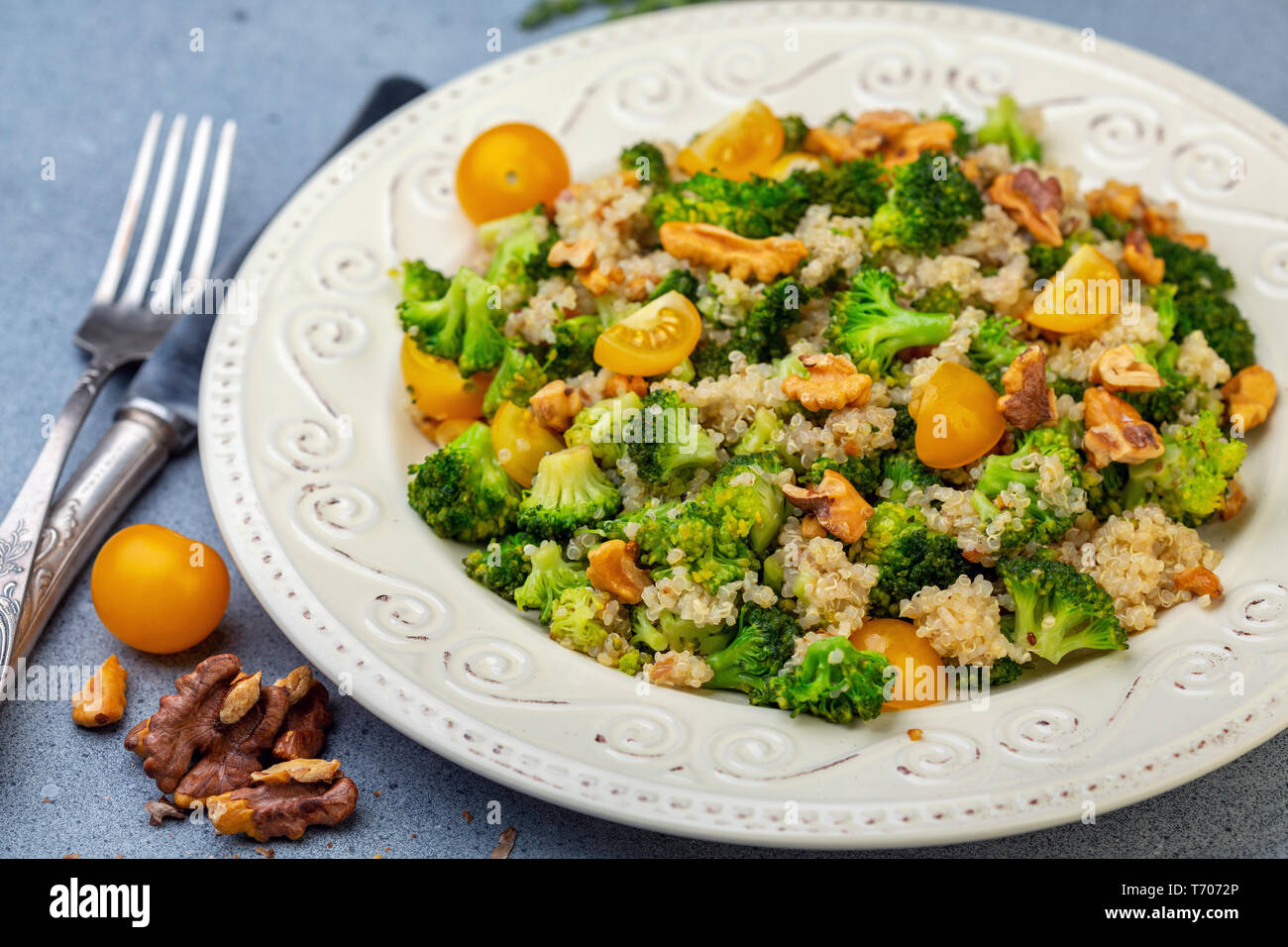 Warm broccoli salad and a movie for a healthy diet. Stock Photo