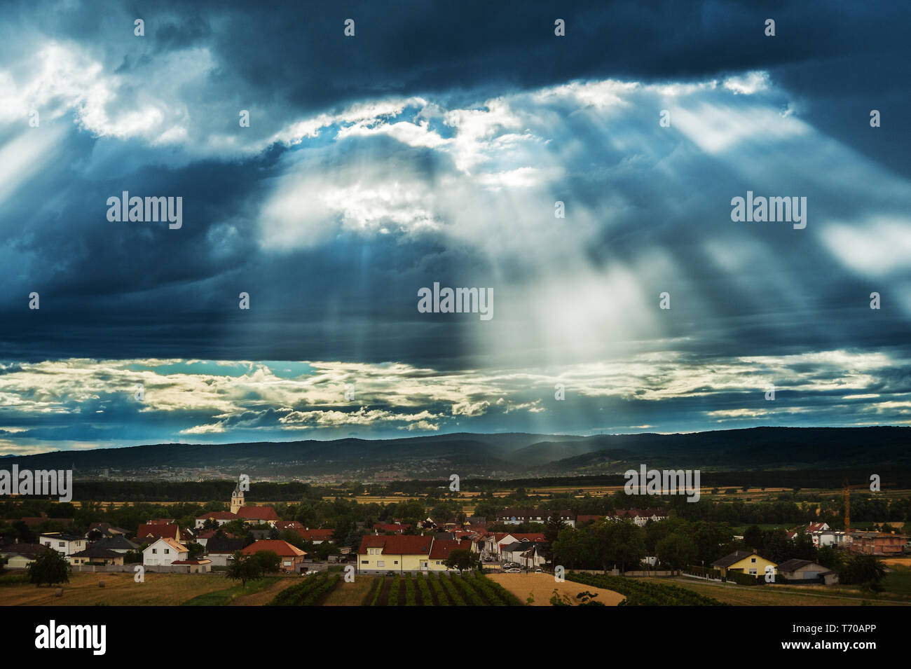 dark clouds abova a small village Stock Photo
