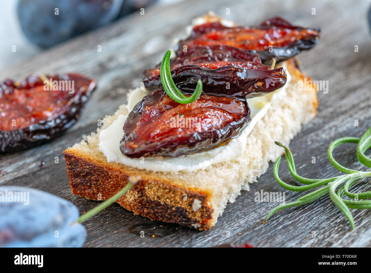 Appetizer of homemade bread and spicy dried plums. Stock Photo