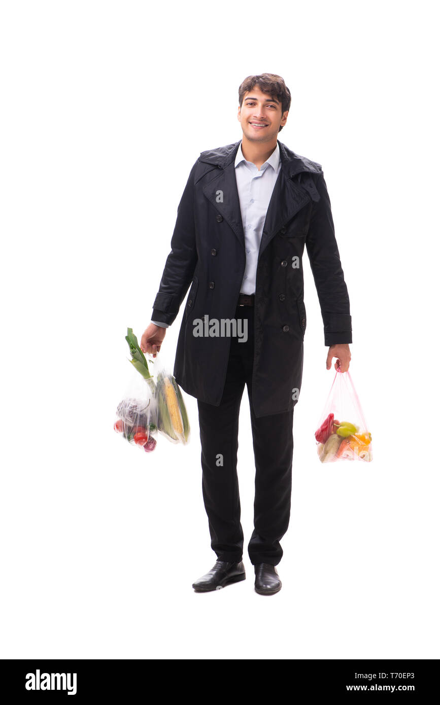 Young handsome man with vegatables in shopping concept Stock Photo
