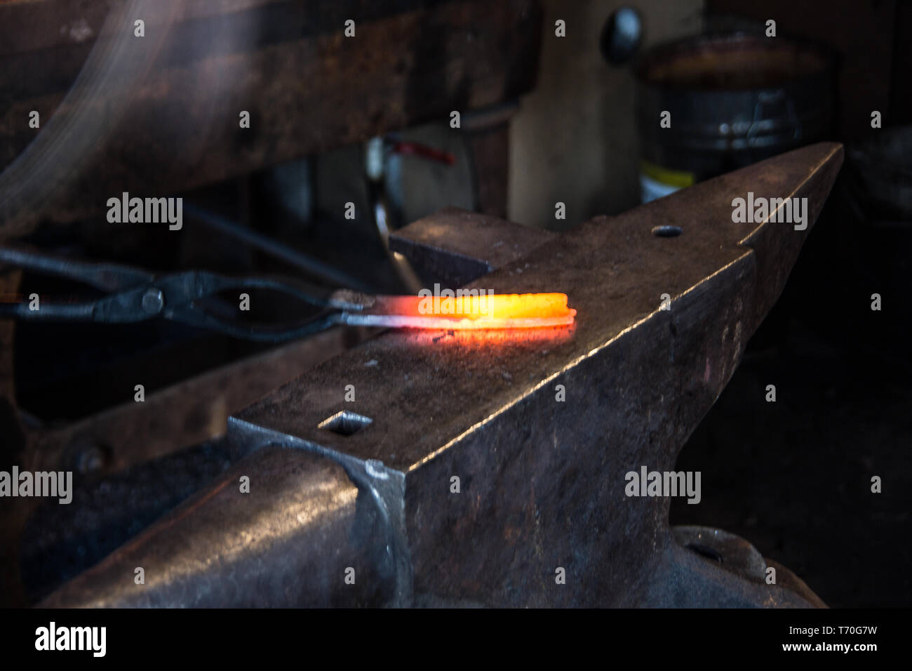 Glowing iron in the smithy Stock Photo