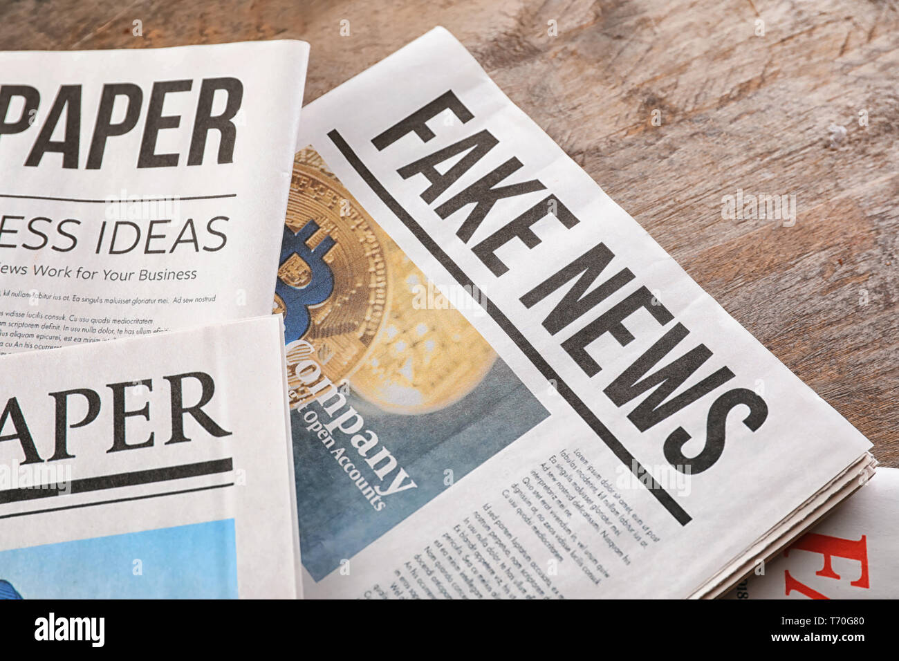 Newspapers on wooden background Stock Photo