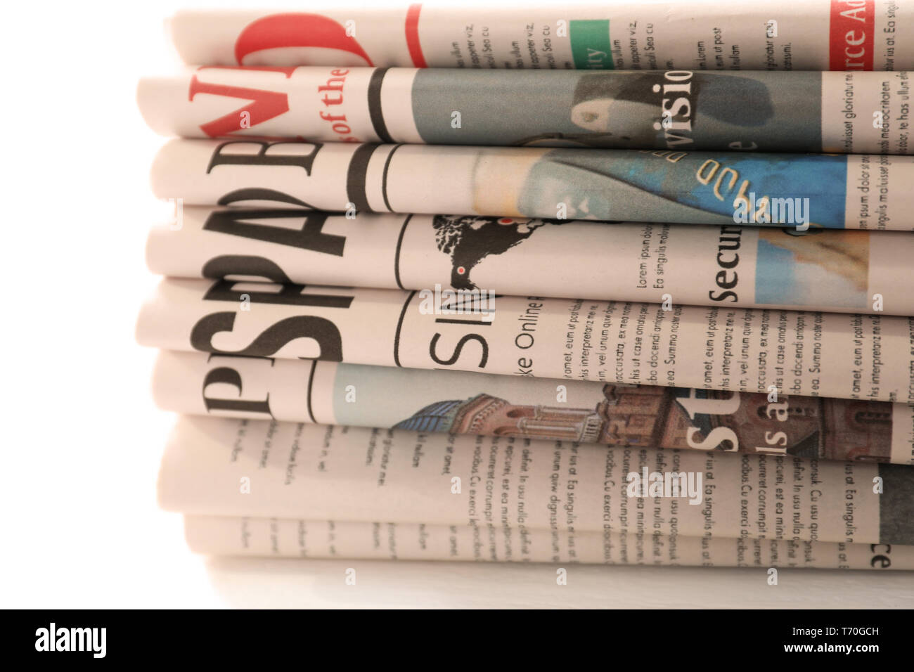 Pile of newspapers on white background Stock Photo