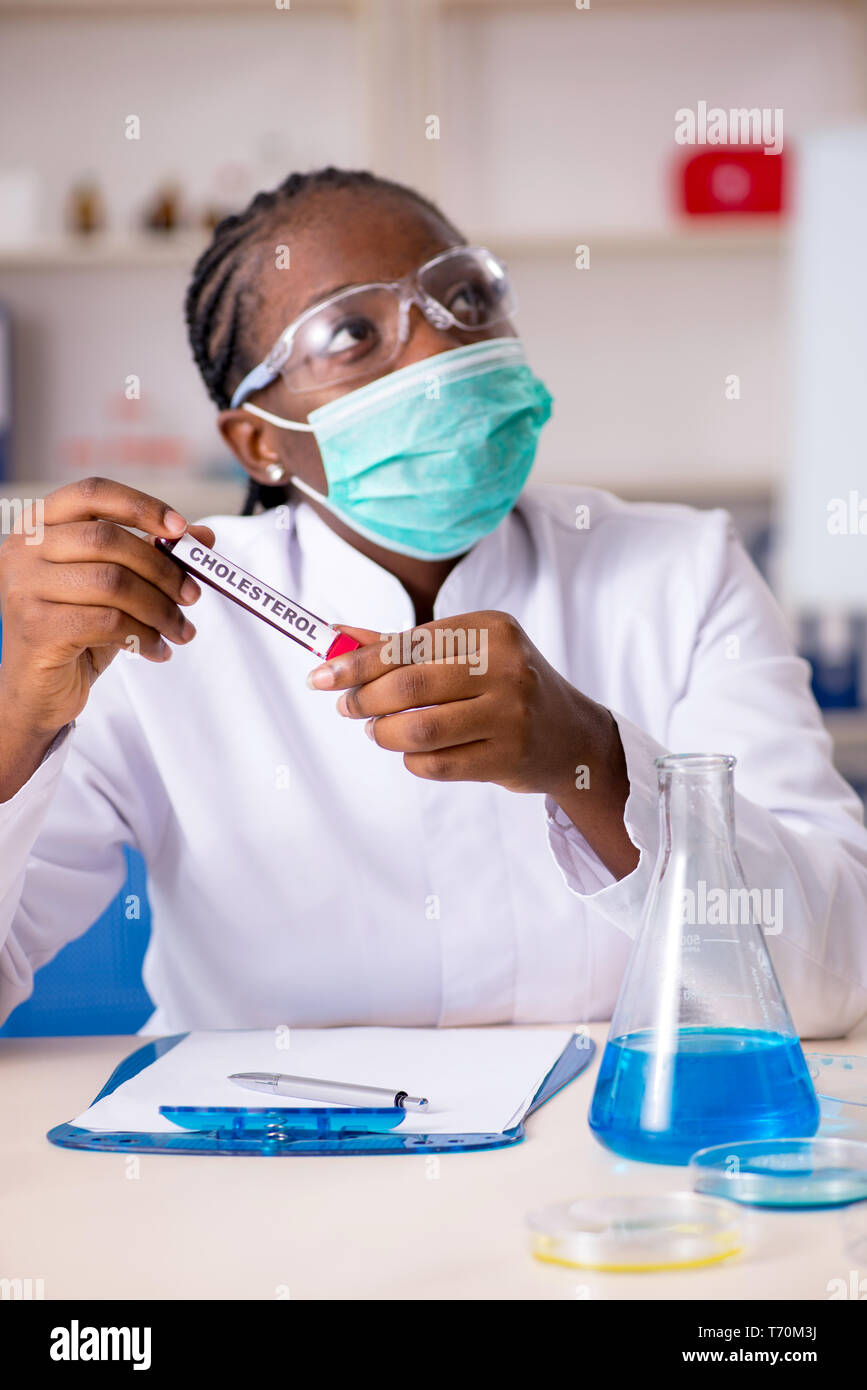 Young black chemist working in the lab Stock Photo