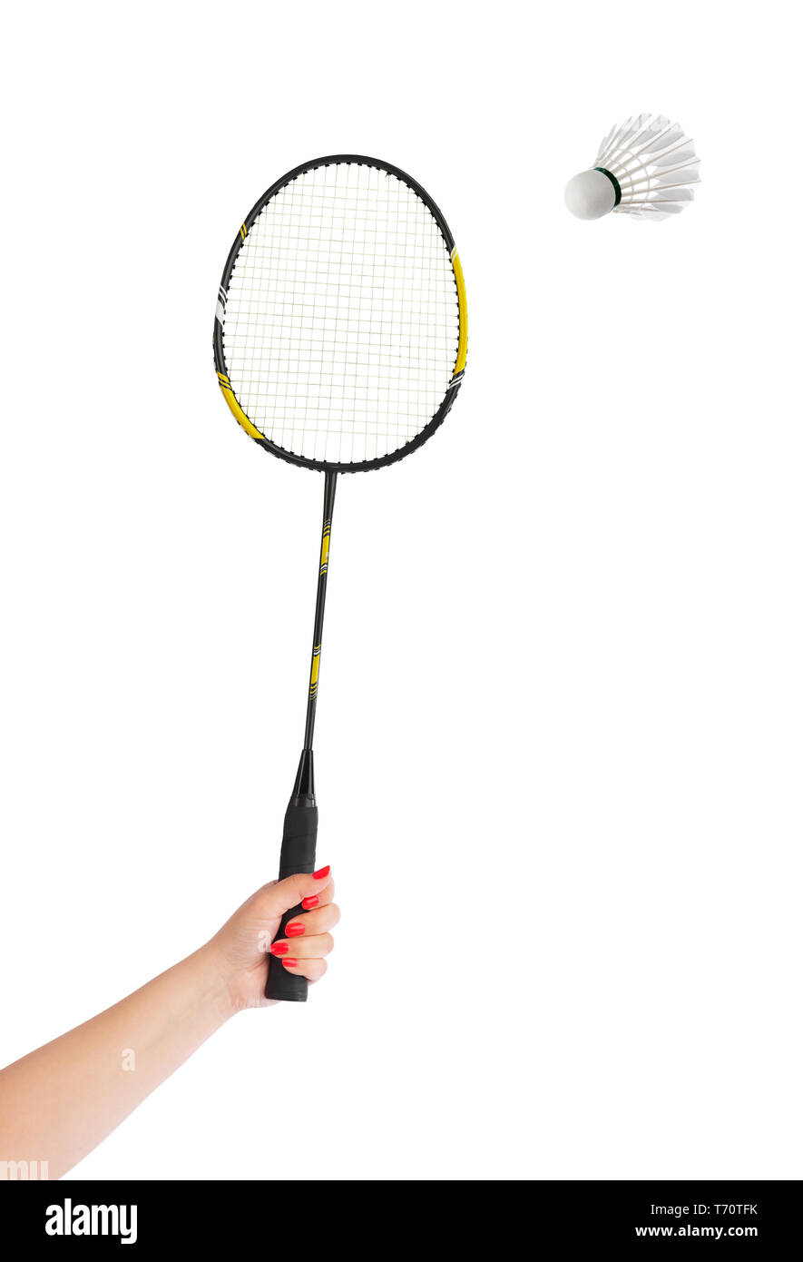 Hand with badminton racket and feather shuttlecock Stock Photo