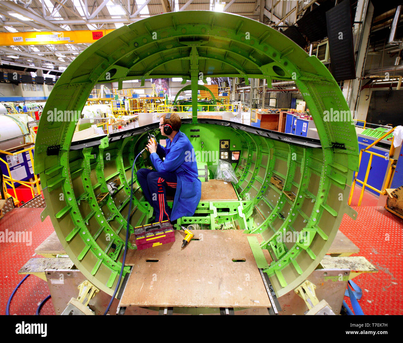 FILE PHOTO - Bombardier aircraft electricians work on Learjet 40 XR aircraft on the production line in Belfast, Northern Ireland, on Monday, Jan. 21, 2008. Almost 1,000 jobs are to go at Bombardier Aerospace factories in Northern Ireland, Thursday, April 2, 2009. A total of 975 staff are losing their jobs, with 310 permanent staff and all 665 agency staff being made redundant. A company statement said it was cutting aircraft production rates and reducing manpower at all its sites because of an 'unprecedented recession'.  Paul McErlane Photography Stock Photo