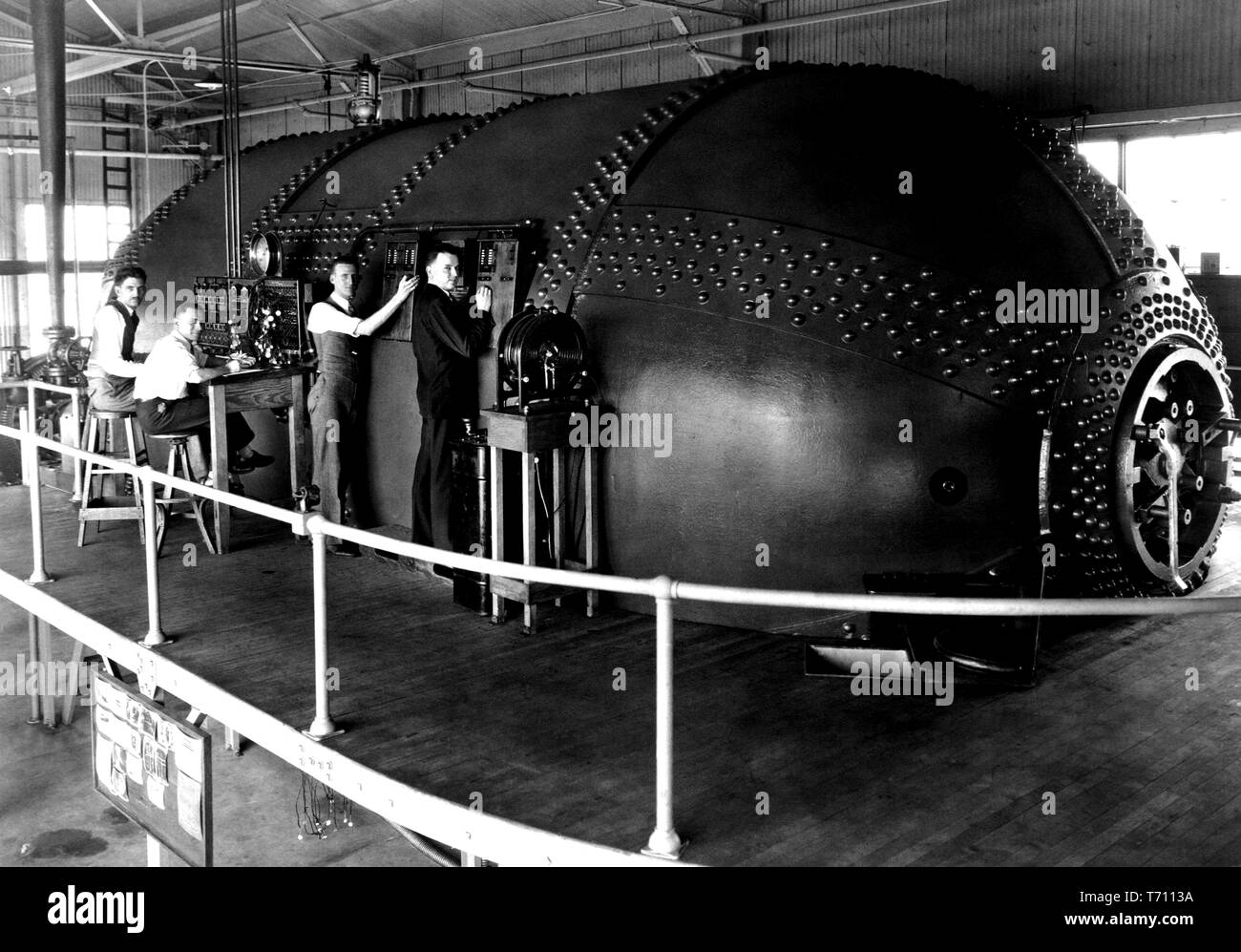 National Advisory Committee for Aeronautics (NACA) staff conducting tests on airfoils in the Variable Density Tunnel, Hampton, Virginia, including staff members Eastman Jacobs, Shorty Defoe, Malvern Powell, and Harold Turner, March 15, 1929. Image courtesy National Aeronautics and Space Administration (NASA). () Stock Photo
