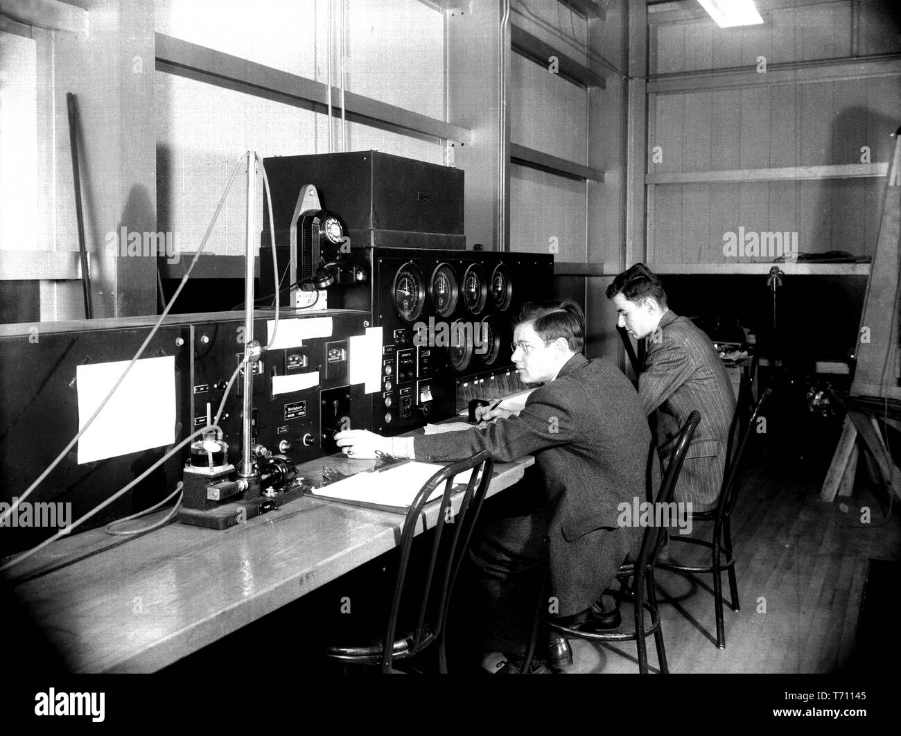 Engineers operating the controls of the Stability Tunnel at Langley Aeronautical Laboratory in Hampton, Virginia, March 10, 1943. Image courtesy National Aeronautics and Space Administration (NASA). () Stock Photo