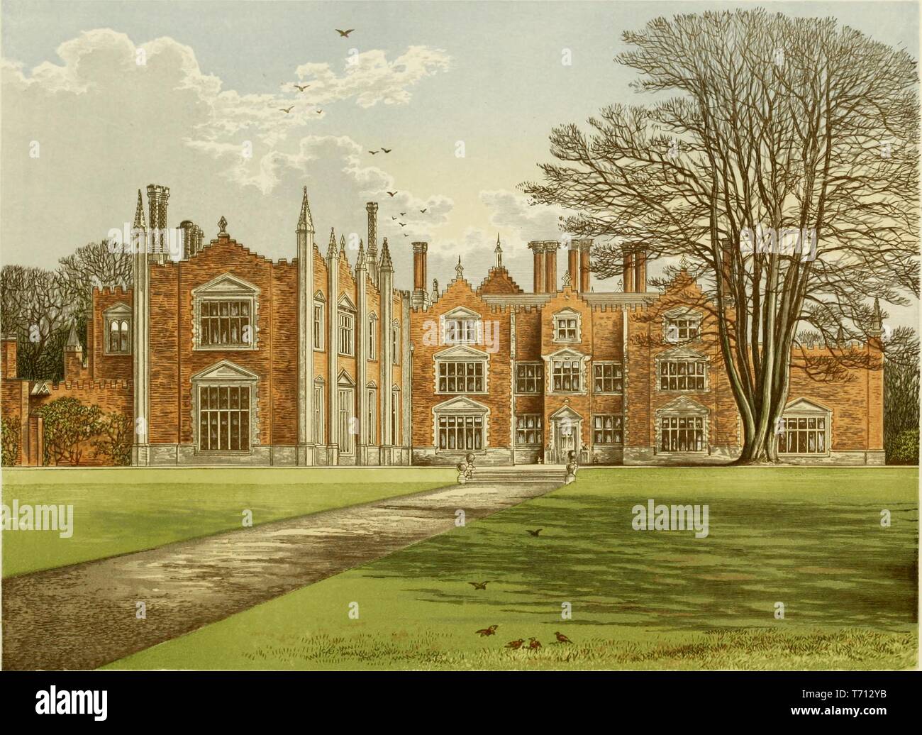 Color print depicting a green lawn with a path leading to Great Witchingham Hall, a 16th or 17th-century country house, with a brick and stone facade, located in Norfolk, England, published in FO (Francis Orpen) Morris's 'A series of picturesque views of seats of the noblemen and gentlemen of Great Britain and Ireland, with descriptive and historical letterpress', 1840. Courtesy Internet Archive. () Stock Photo