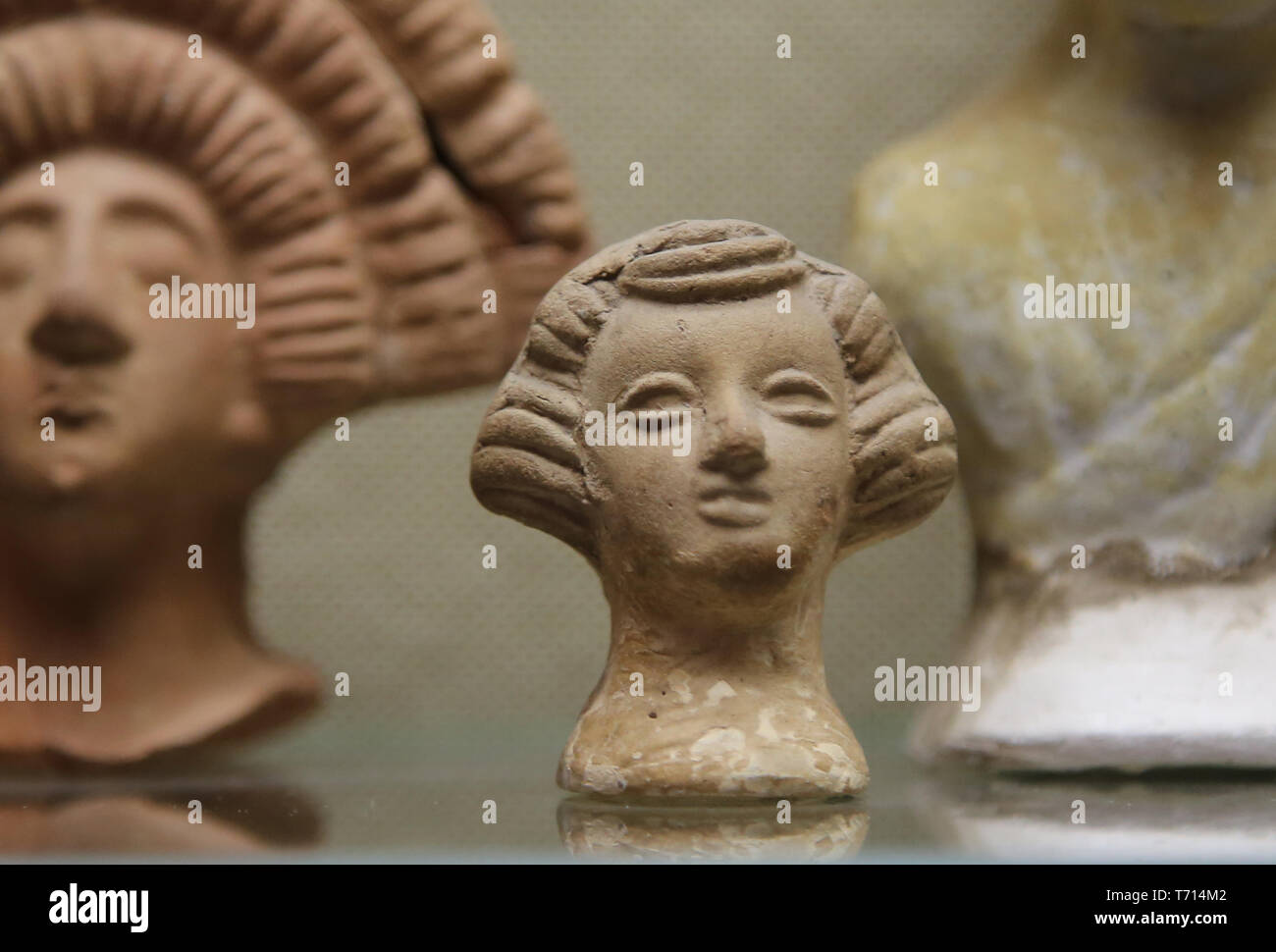 Roman terracotta head with headdress. Archaeological Museum of Seville. Spain. Stock Photo