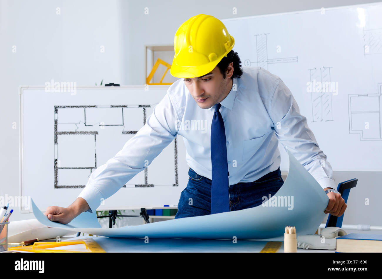 Young handsome architect working on the project Stock Photo