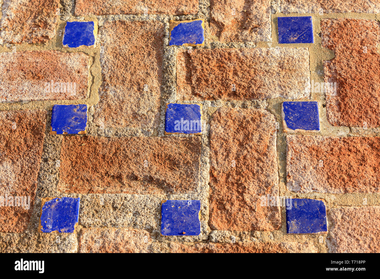 Clay and blue Italian geometric mosaic tiled  floor Stock Photo