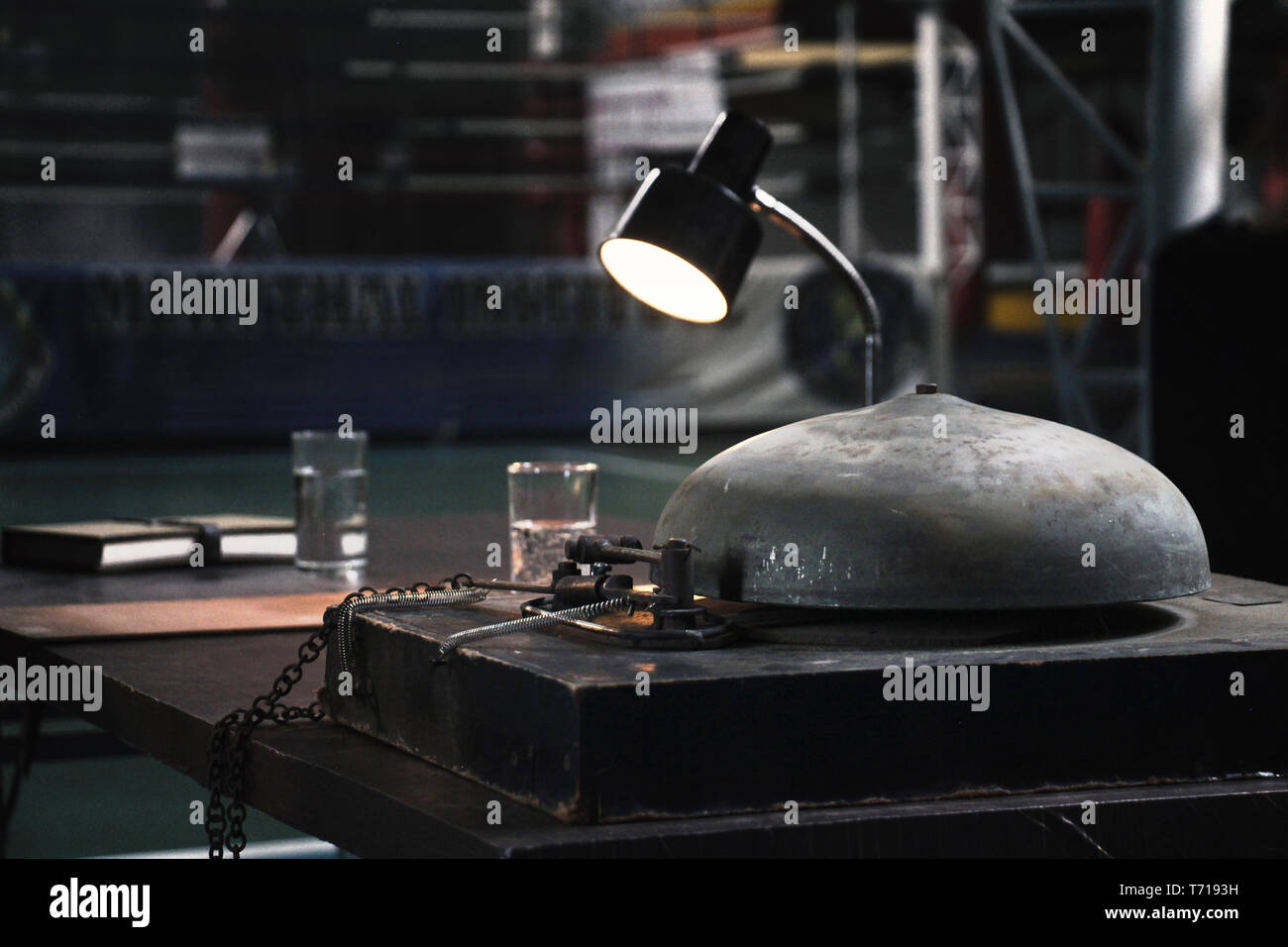 on the table of referee at a side of boxing ring there are a ring bell ...