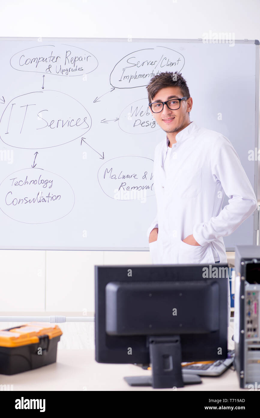 Young it specialist standing in front of the whiteboard Stock Photo