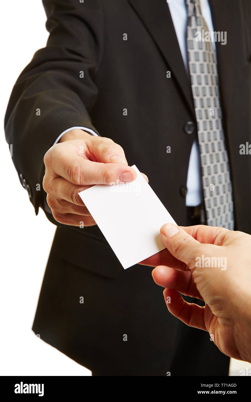 Hand of a businessman gives a business card as a contact Stock Photo