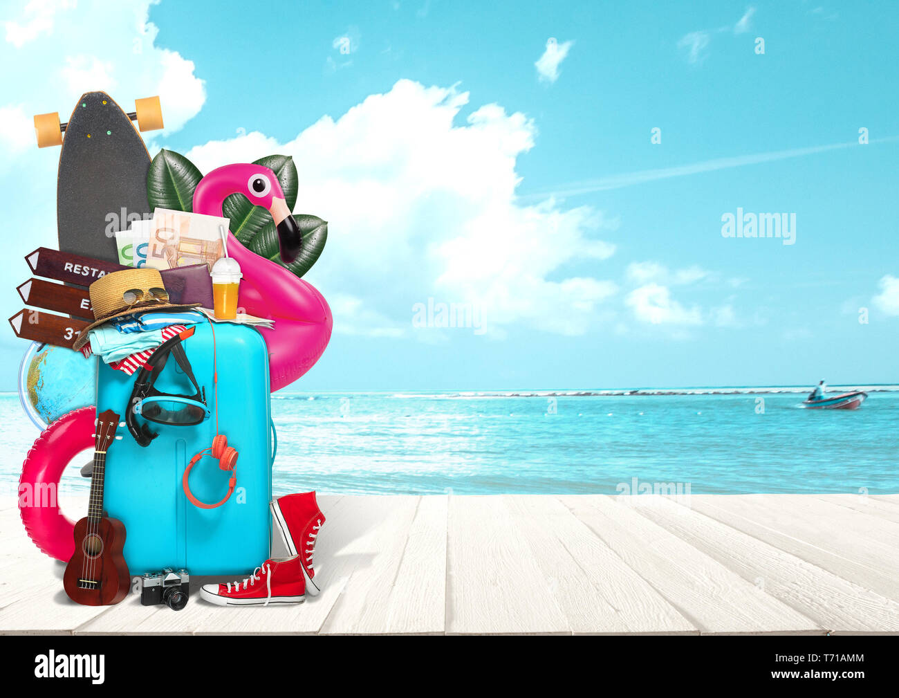 Collage of luggage for travel in front of ocean view. Concept of summertime, resort, journey, trip, travel. Needed things. Skateboard, guitar, camera, headphones, money hat sunglasses clothes Stock Photo