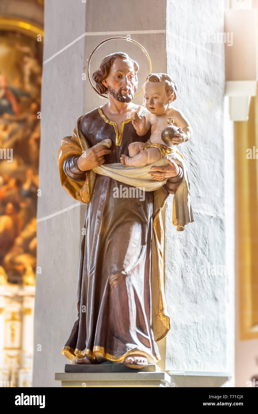 Saint with baby Jesus in his hands Stock Photo