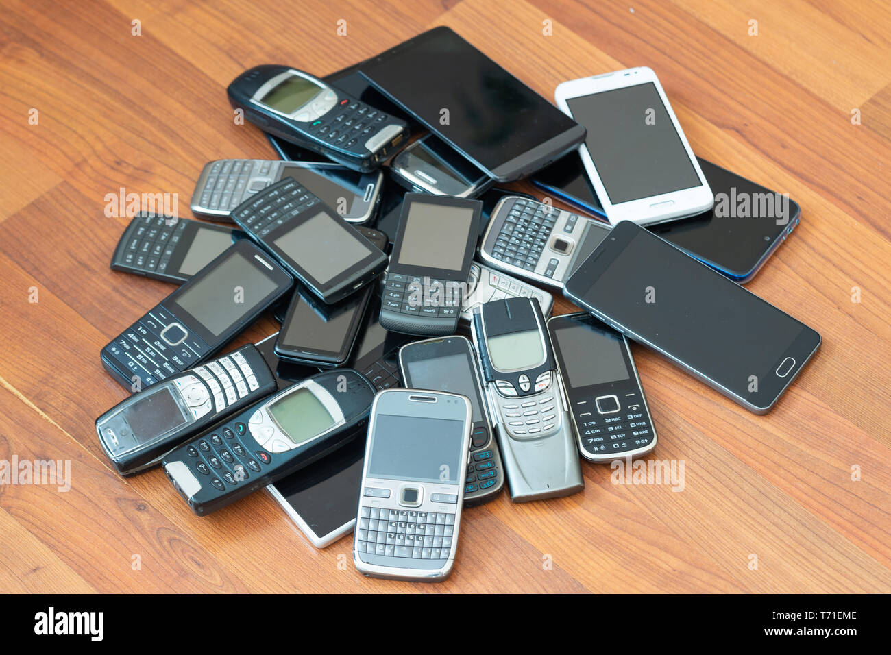 Pile of mobile phones. Old and new models Stock Photo
