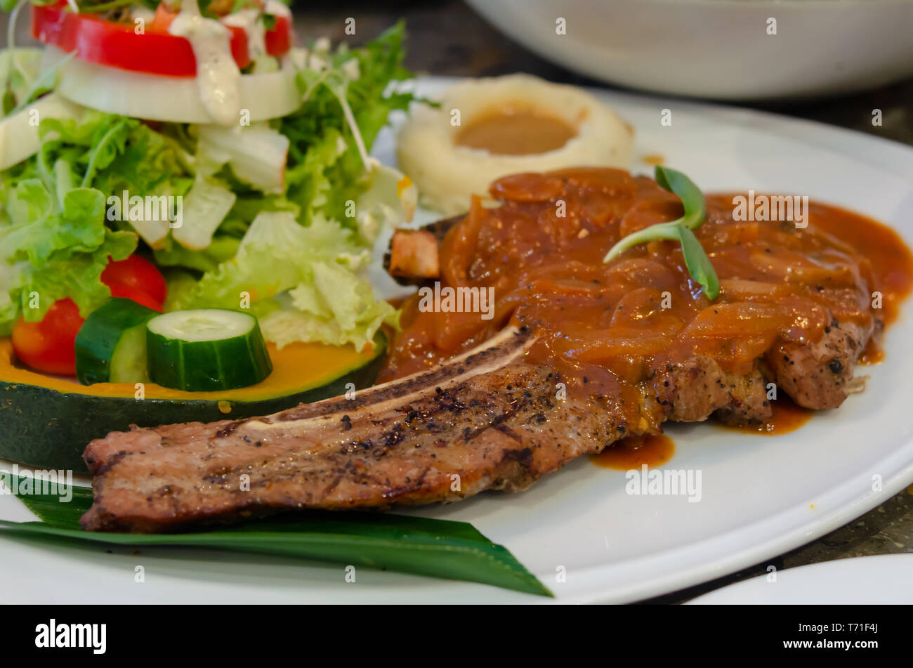 pork-steak-and-vegetable-salad-in-a-plate-stock-photo-alamy