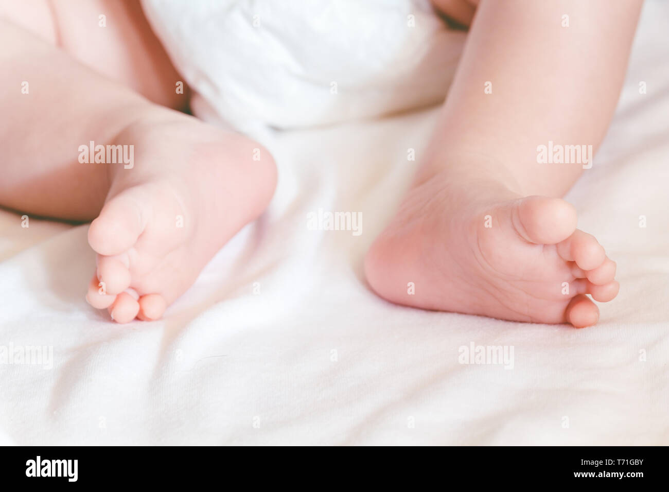 New born baby feet Stock Photo - Alamy