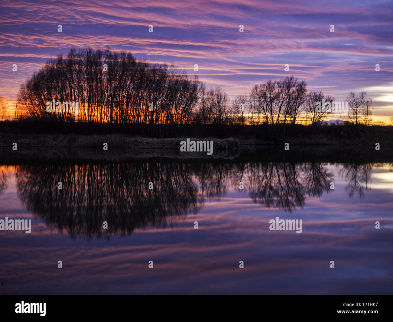 Reflections of sunset at the lake Stock Photo