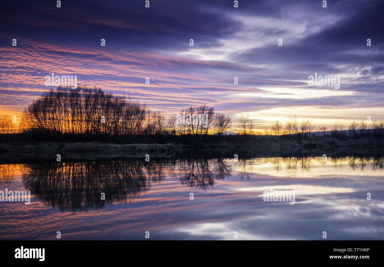 Reflections of sunset at the lake Stock Photo