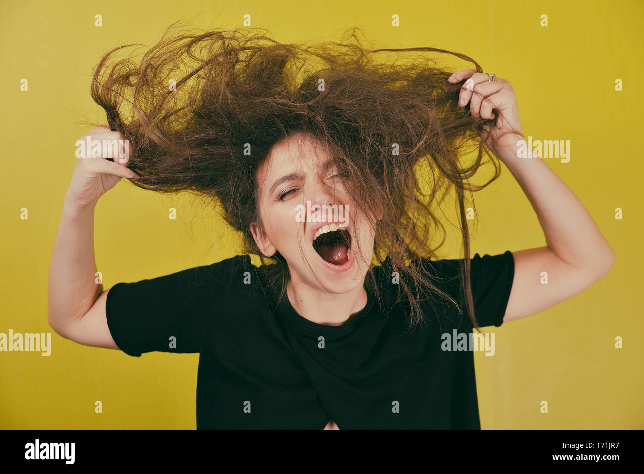 angry woman with a strange hair style  Stock Photo