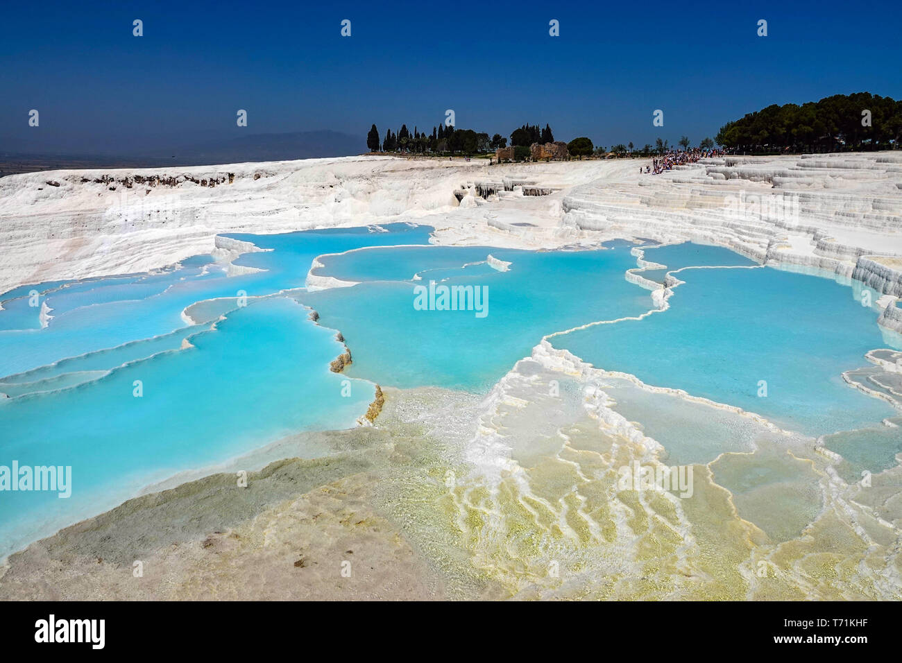 Tourists at Pamukkale hot springs and travertine pools, UNESCO world