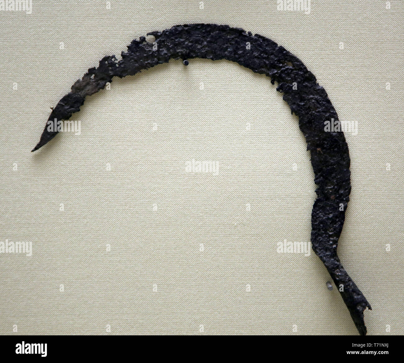 Roman era. Agricultural tool. Sickle. Andalucia, Spain. Archaeological Museum of Seville. Spain. Stock Photo