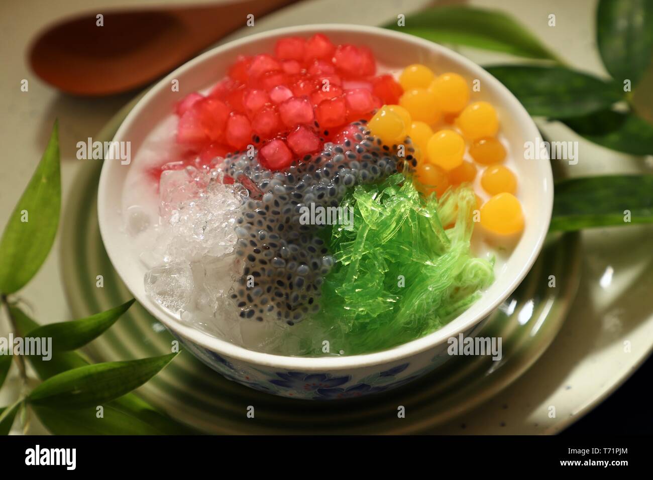 Icy Asian dessert of Thai red ruby pearls, bubble jelly, agar noodles