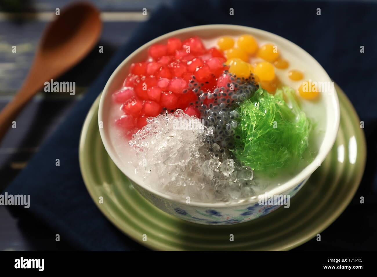 Icy Asian dessert of Thai red ruby pearls, bubble jelly, agar noodles