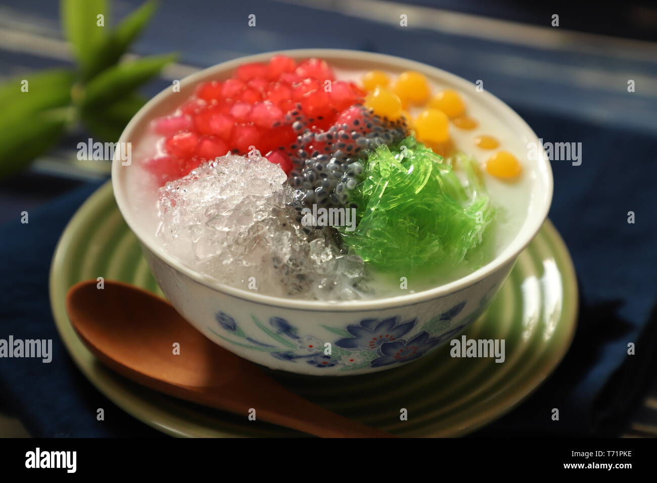Icy Asian dessert of Thai red ruby pearls, bubble jelly, agar noodles
