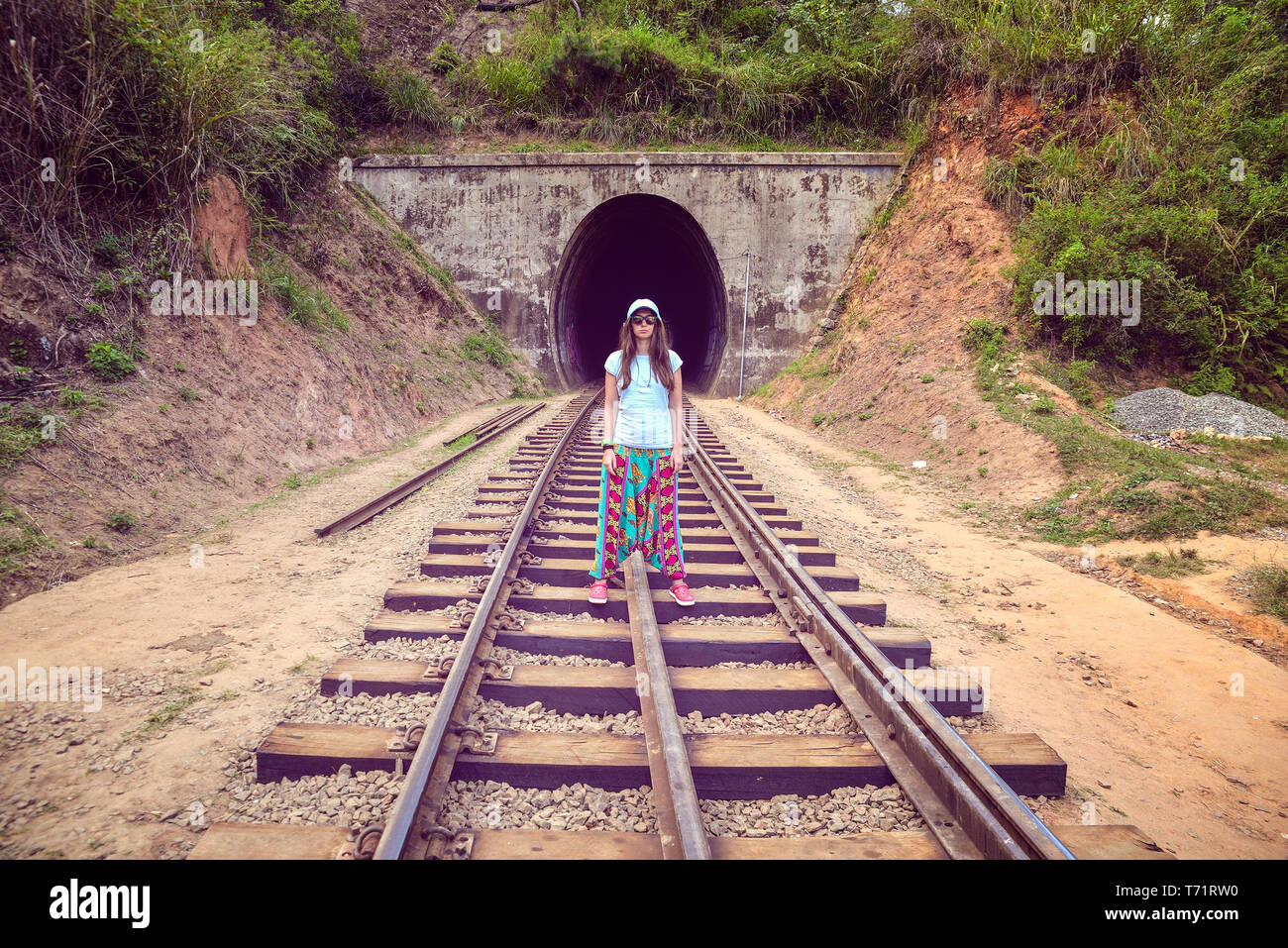 woman standing on the rails  Stock Photo