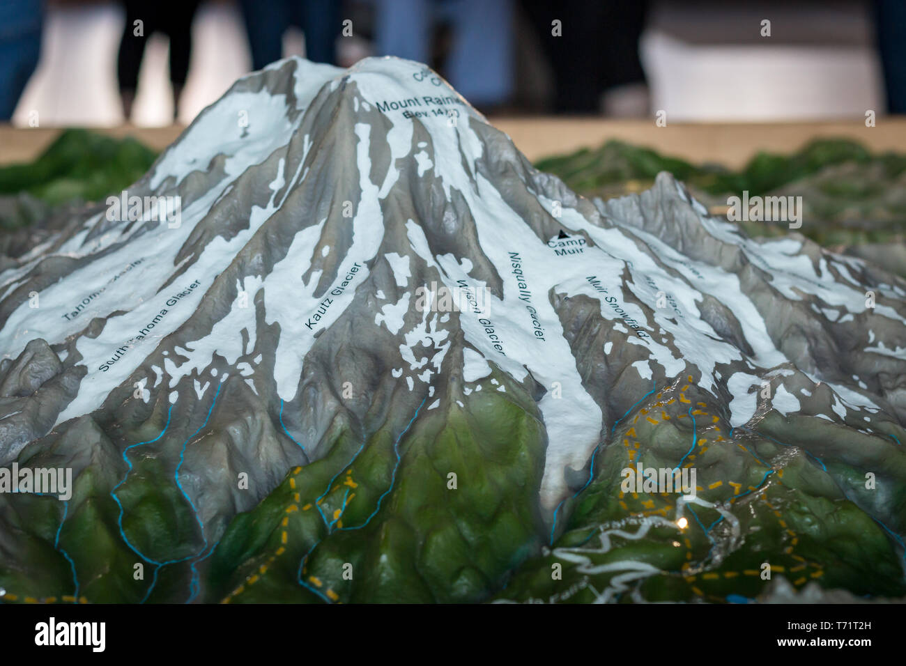 A model of Mt Rainier at the center is labeled with the various