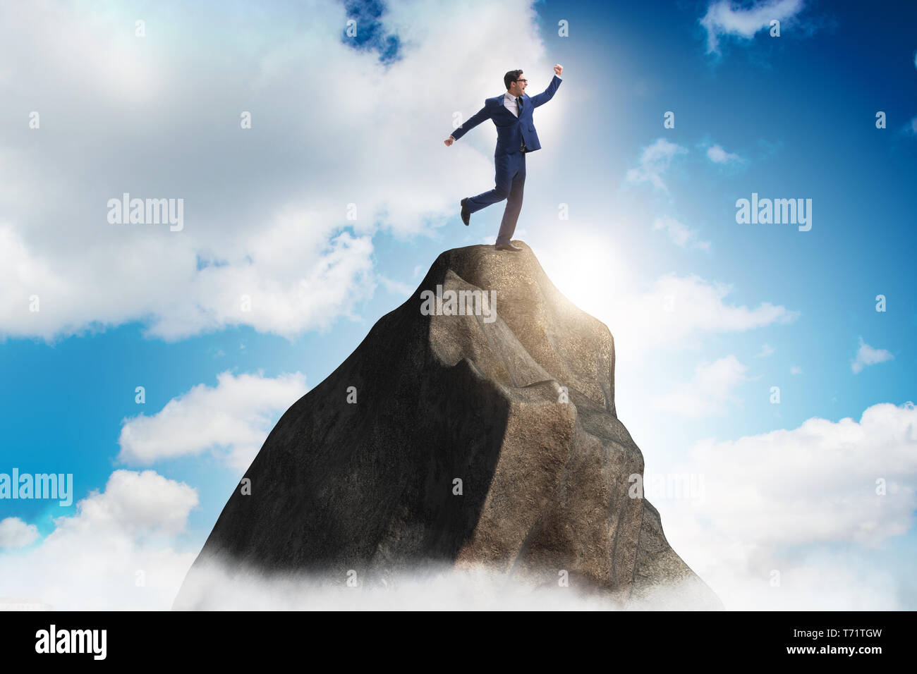 Businessman at the top of mountain Stock Photo - Alamy