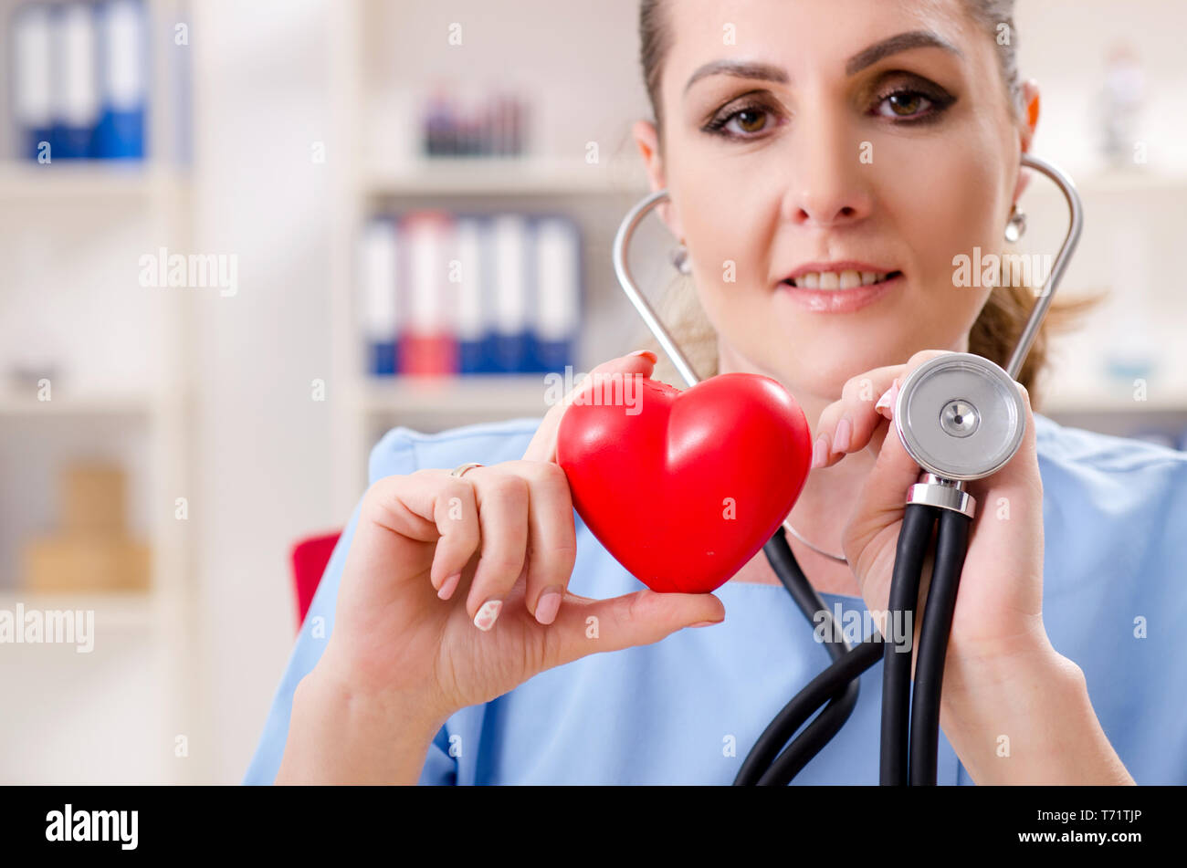 Female doctor cardiologist working in the clinic Stock Photo - Alamy