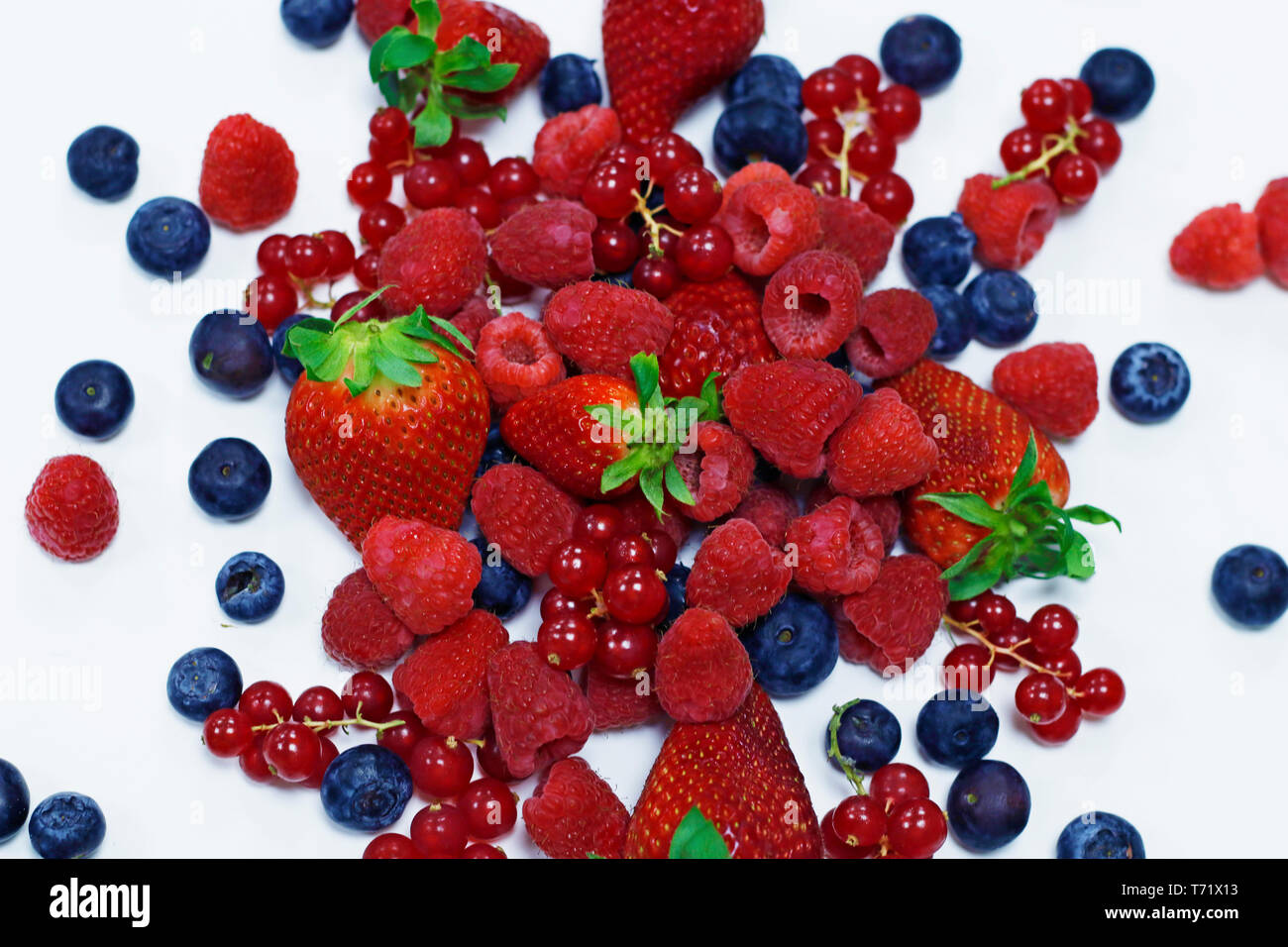 assorted fresh berries with white background Stock Photo - Alamy