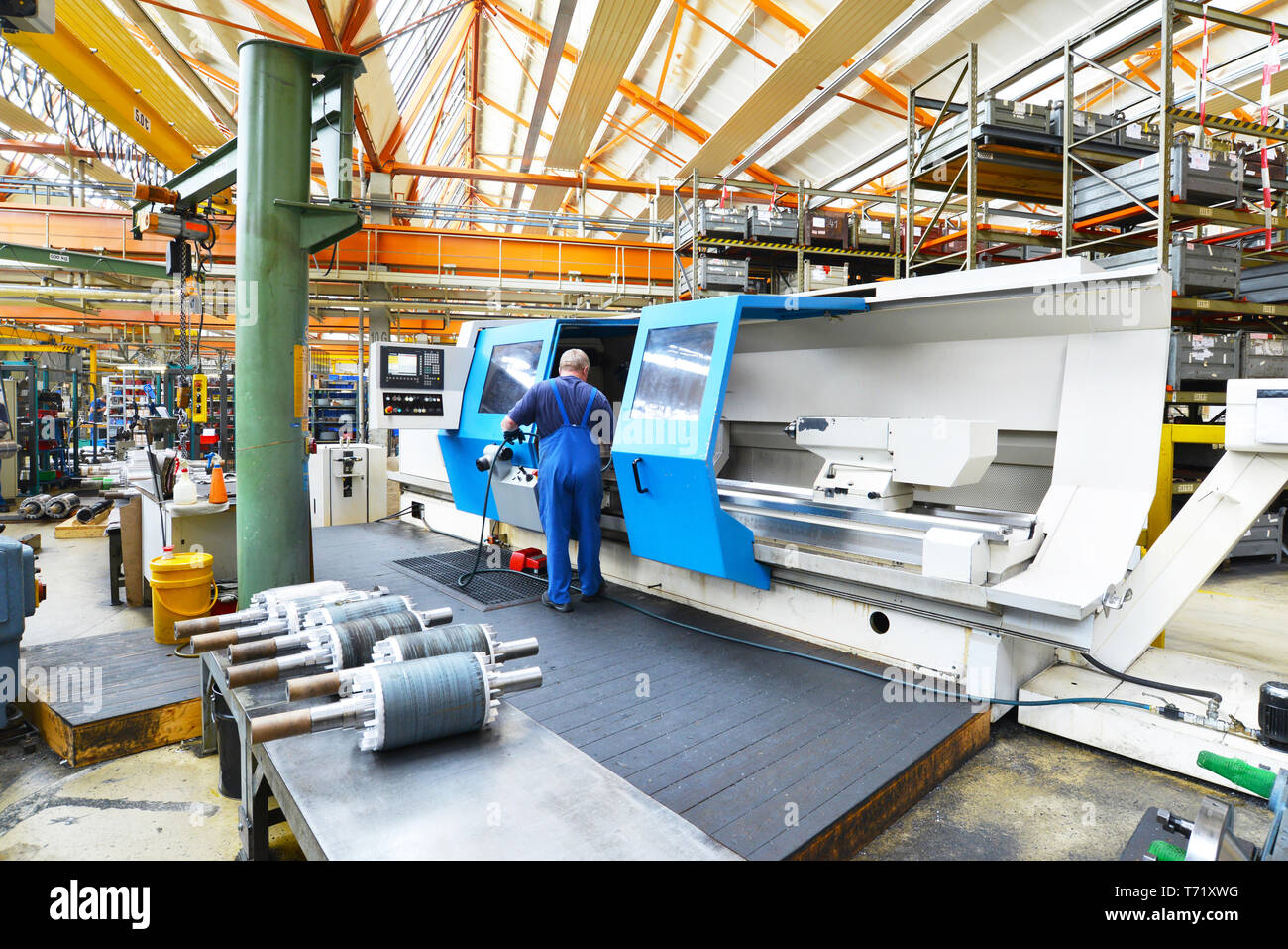 large modern cnc machine for the production of shafts for industrial electric motors in the company Stock Photo