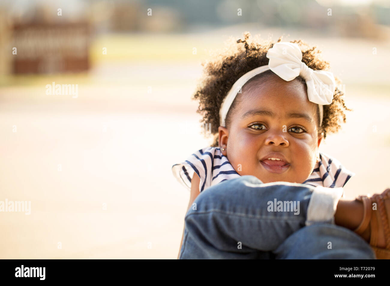 Happy African American little girl laughing and smiling outside Stock ...