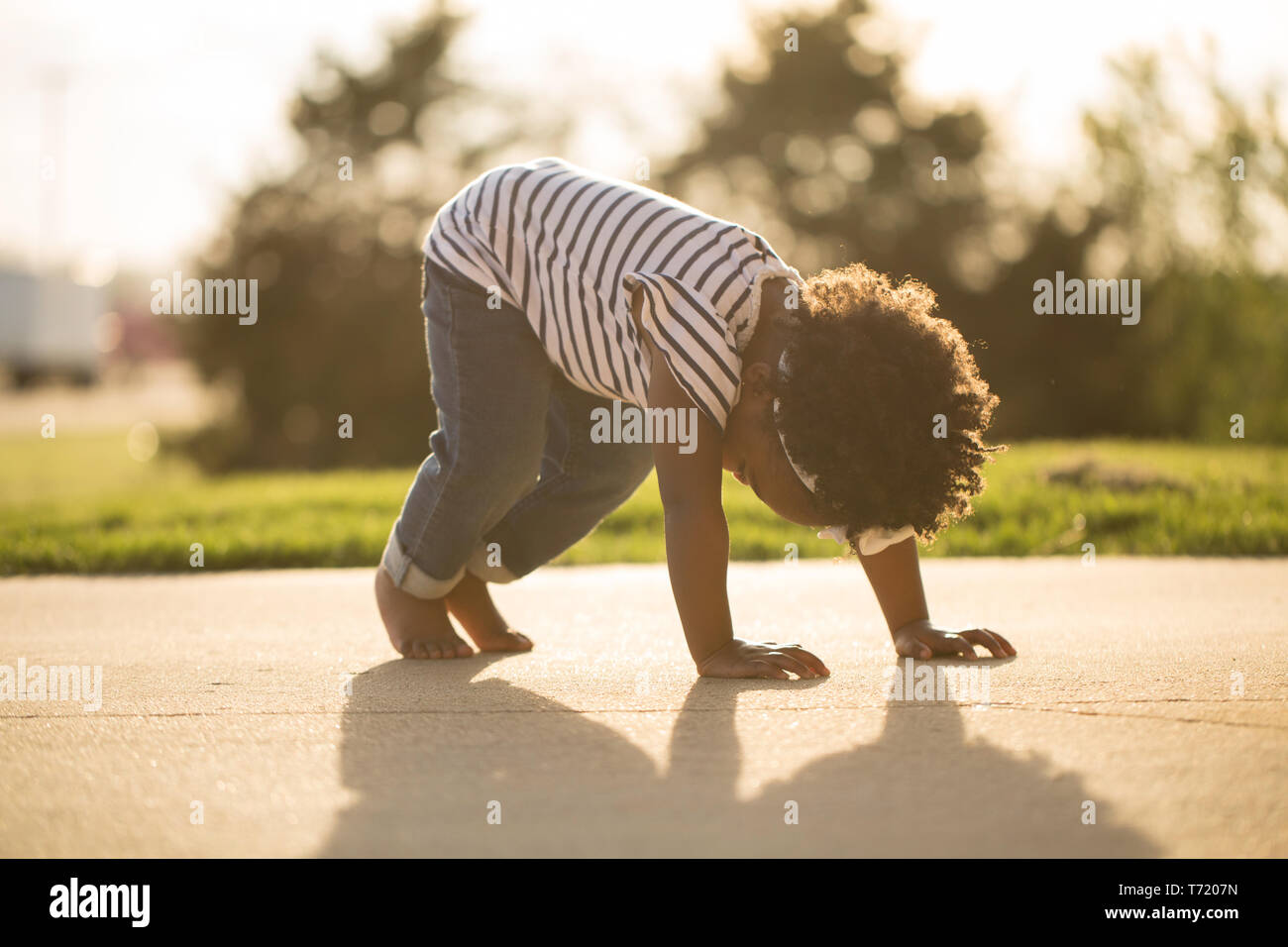 Happy African American little girl laughing and smiling outside Stock ...