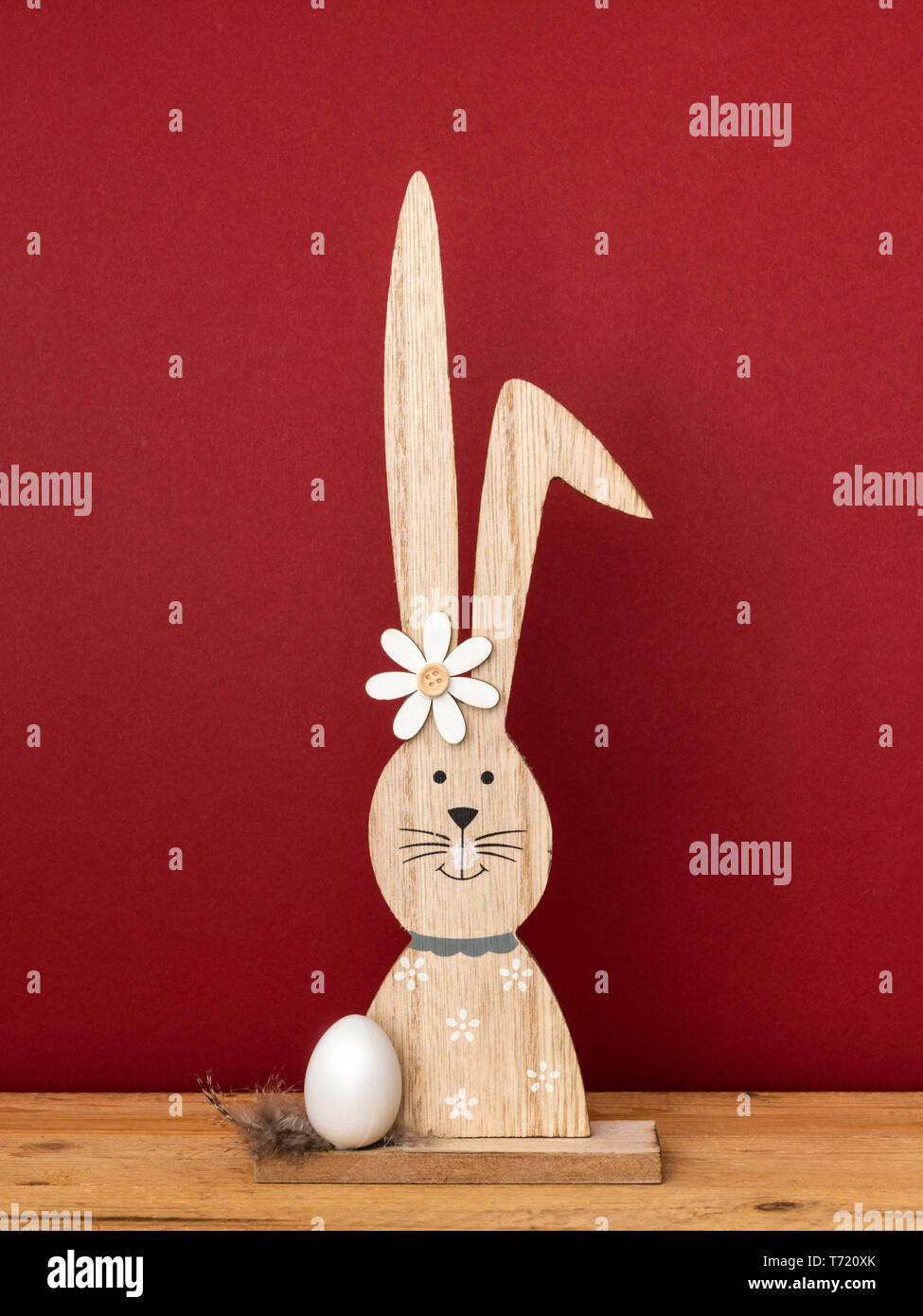 a sweet easter bunny figure with an egg Stock Photo