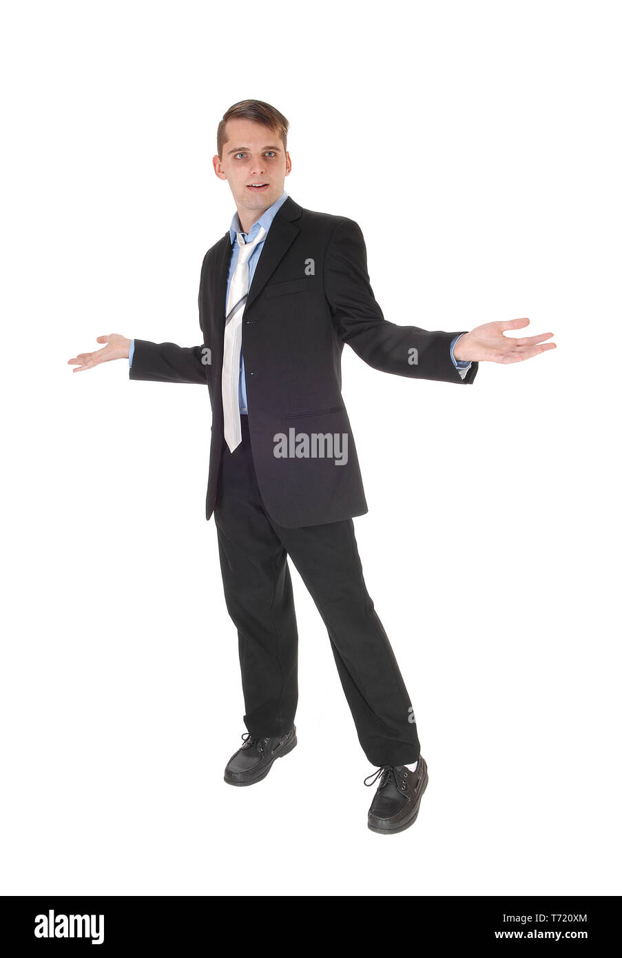 A man standing with hands outstretched is perplex Stock Photo