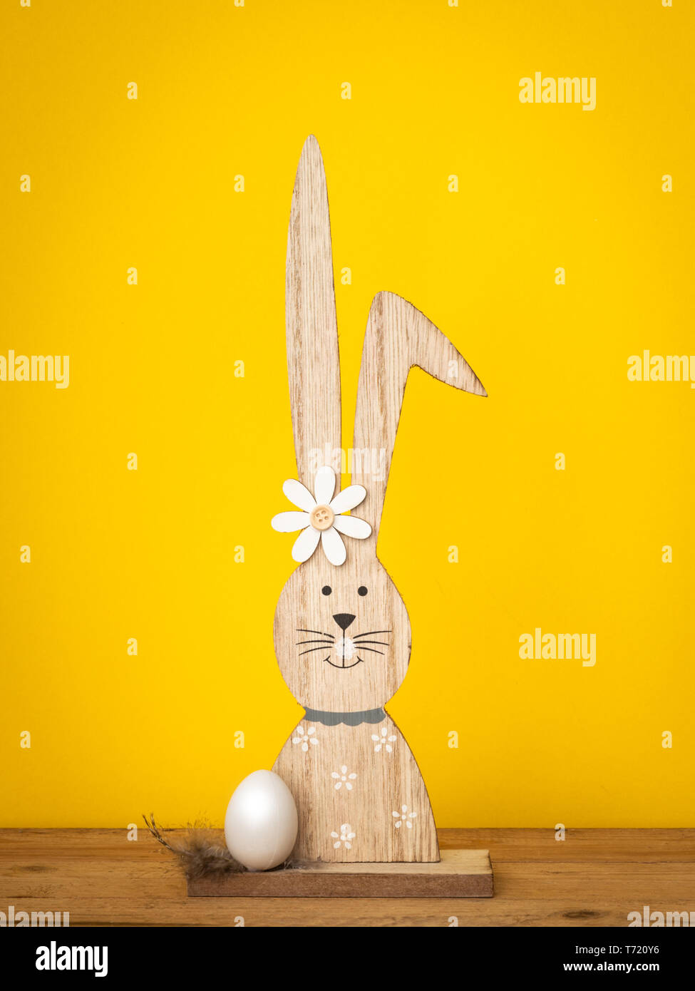 a sweet easter bunny figure with an egg Stock Photo