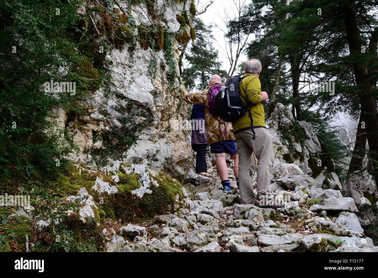Hikers walking on a well trodden footpath Llogora National park Albania Stock Photo