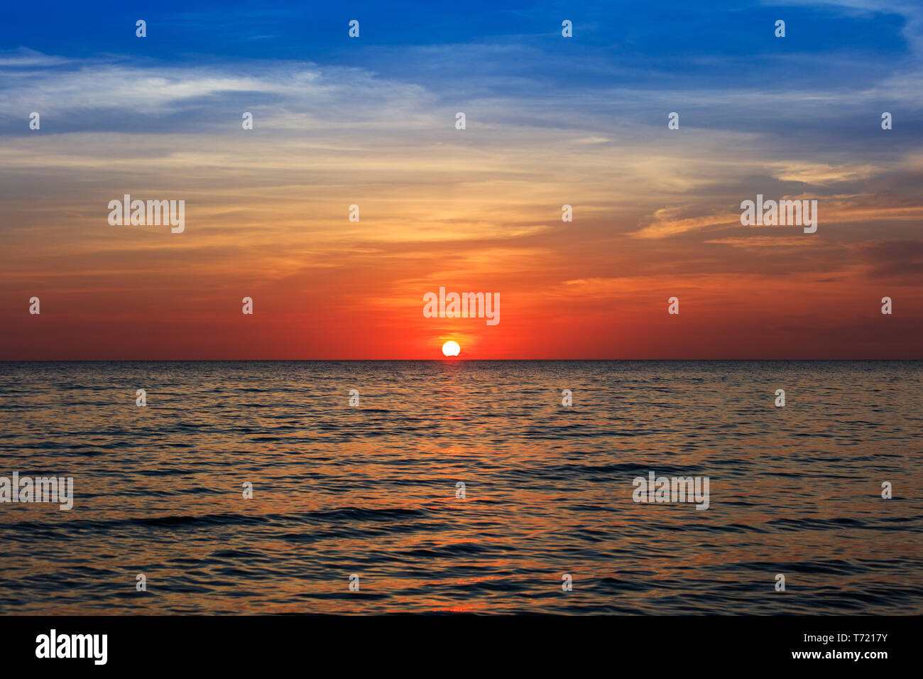 cloudy sunset over the ocean Stock Photo