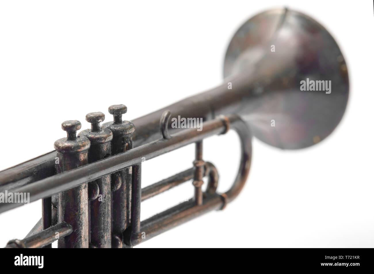 Vintage toy, closeup trumpet on white background. Stock Photo